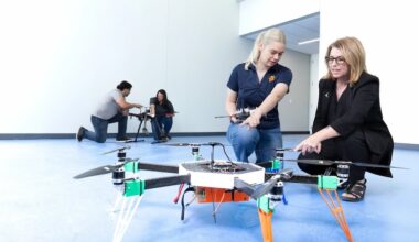 Shery Welsh, Ph.D., far right, works with UTEP students in the Aerospace Center