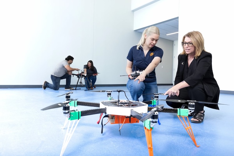 Shery Welsh, Ph.D., far right, works with UTEP students in the Aerospace Center