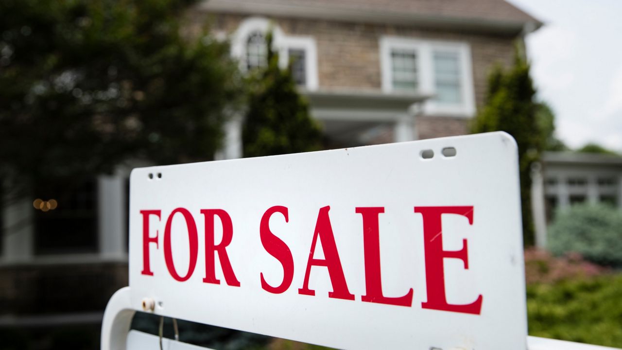 A "for sale" sign stands in front of a house, in Jenkintown, Pa., Friday, June 8, 2018. (AP Photo/Matt Rourke)