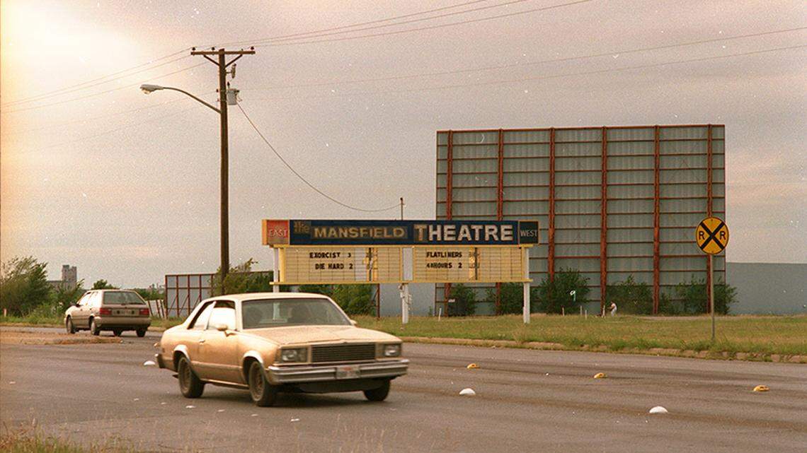 Sept. 30, 1990: Mansfield Drive-in on East Seminary Drive, Fort Worth. There is a sign visible that reads “The Mansfield Theatre” with a list of movies underneath, including The Exorcist III, Die Hard 2, Flatliners, and Another 48 Hrs.