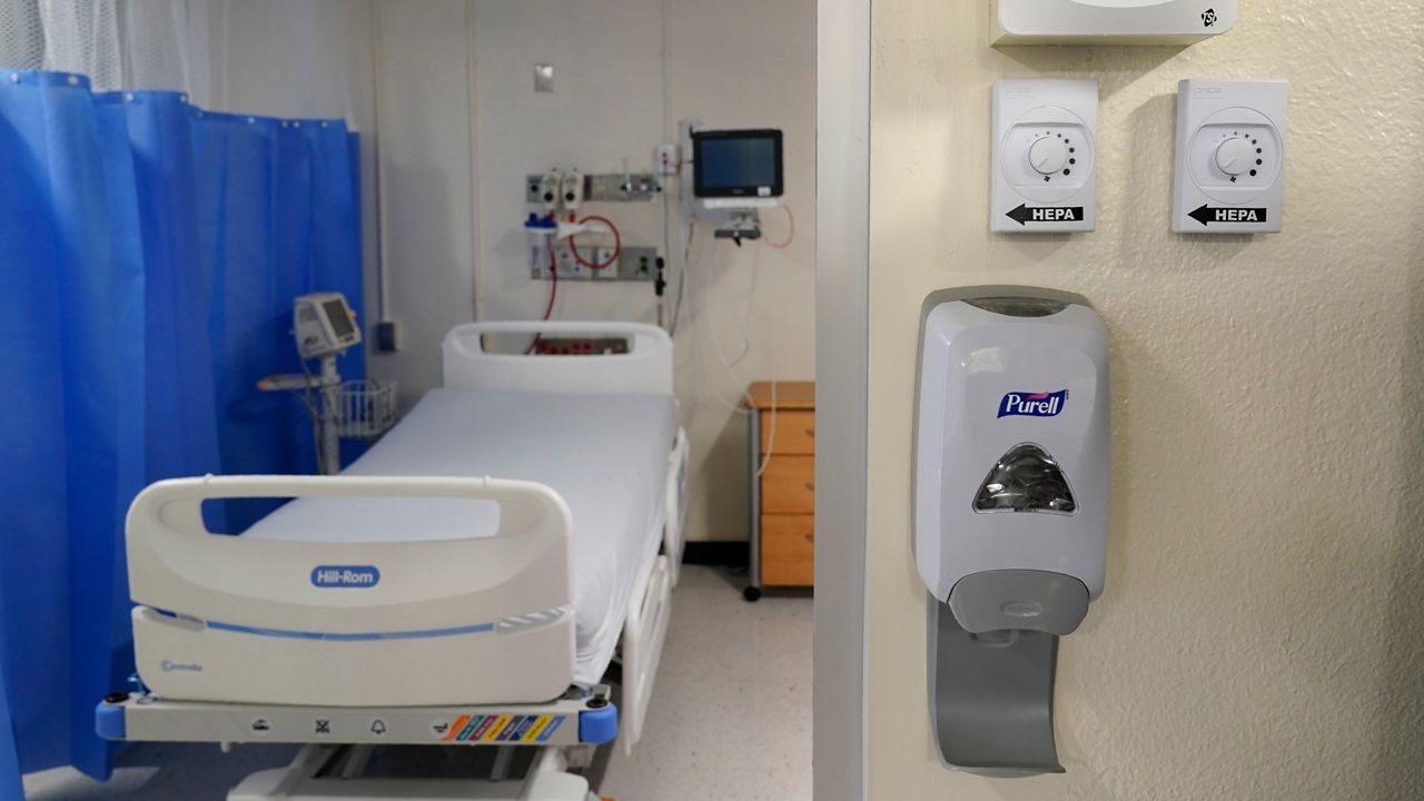 New machinery, right, that helps to turn a regular hospital room into an isolation room at Bellevue Hospital in New York. (AP Photo/Seth Wenig)