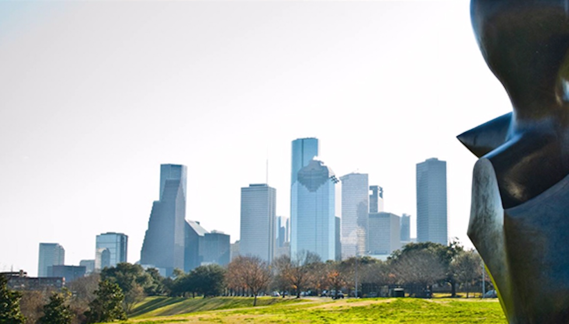 The downtown Houston skyline, with a cropped large bronze sculpture in the immediate foreground.