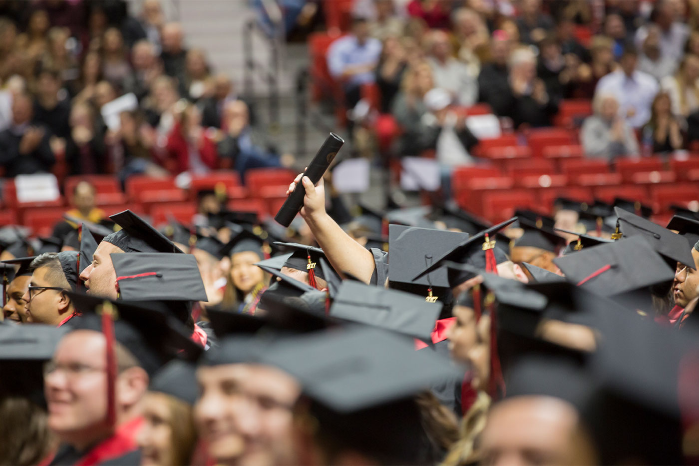 Wide shot of graduating students during commencement in the United Supermarkets Arena