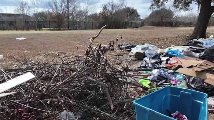 Trash piles up near high school as neighbors demand action