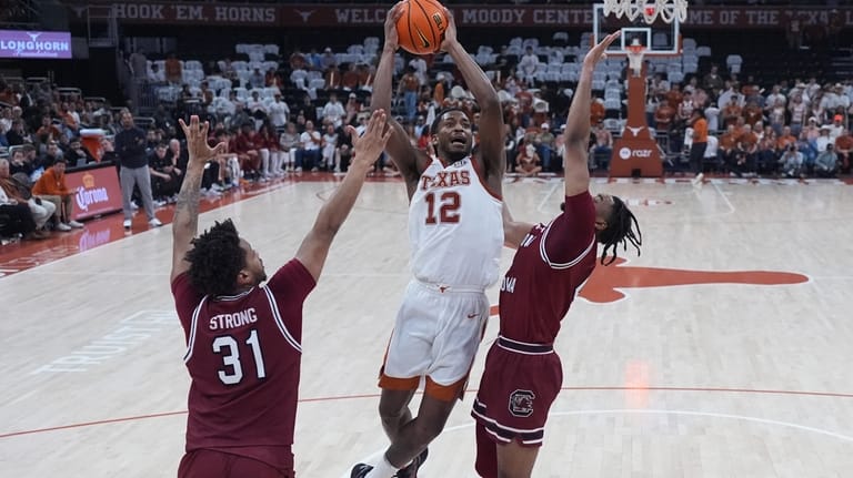 Texas guard Tramon Mark (12) drives to the basket against...