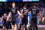 Dallas Mavericks forward Cooper Flagg (32) gets a high-five from his teammate forward Naji...