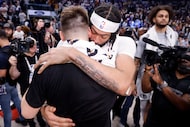 Los Angeles Lakers guard Luka Doncic (back to camera) receives a hug from Dallas Mavericks...