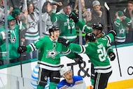 Dallas Stars left wing Jason Robertson (21) celebrates with center Roope Hintz (24) and...