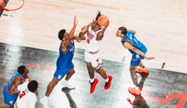 Grant McCasland and Geoff Haxton sit together and talk on stage at Rudy's BBQ during the weekly Texas Tech basketball radio show.