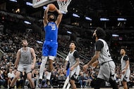 Dallas Mavericks forward Marvin Bagley III (35) dunks during the first half of an NBA...