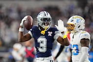 Dallas Cowboys wide receiver George Pickens (3) celebrates catching a pass in front of Los...