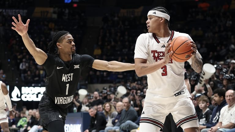 Texas Tech forward Lejuan Watts (3) is defended by West...