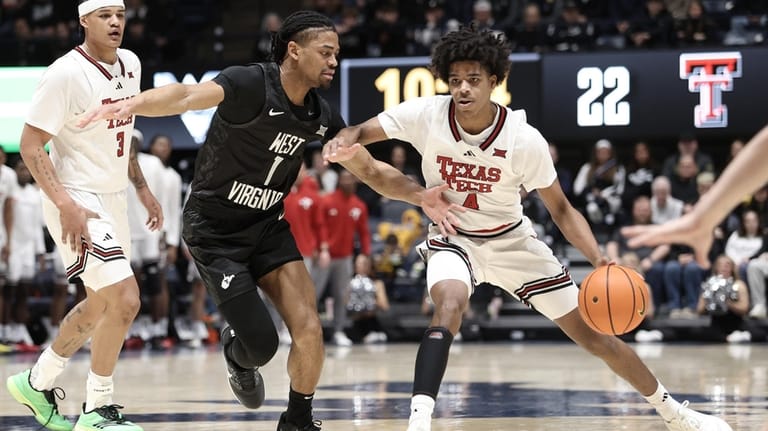 Texas Tech guard Christian Anderson (4) is defended by West...