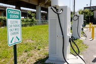 An electric vehicle charging station is seen along South Good Latimer Expressway, Thursday,...