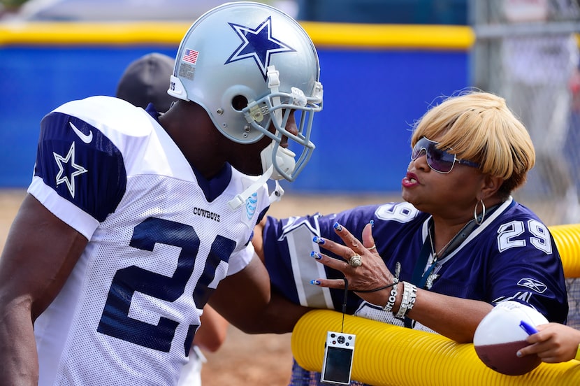 Carolyn Price greets running back DeMarco Murray during the afternoon practice at Dallas...