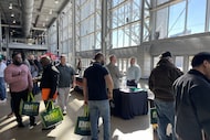 Job seekers mingle with recruiters during the DAV and RecruitMilitary job fair in Arlington...