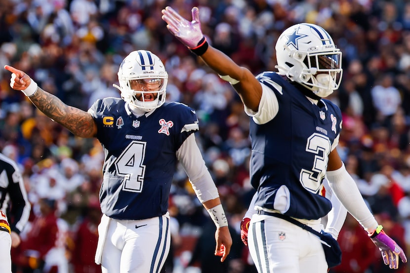 Dallas Cowboys quarterback Dak Prescott (4) and wide receiver George Pickens (3) signal...