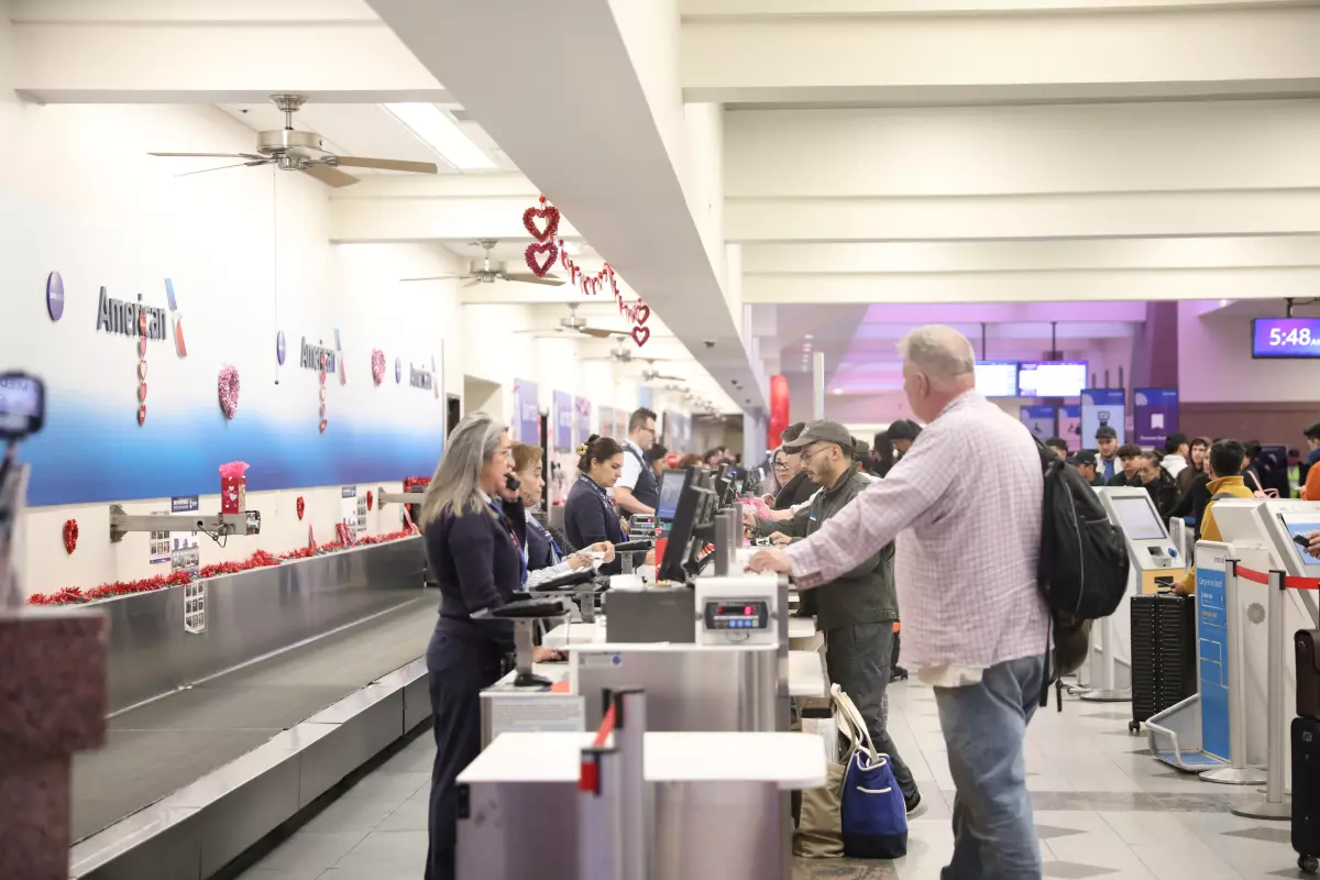 Passengers at the El Paso International Airport check on the status of their flights amid a temporary flight restriction for El Paso airspace. The TFR will last for 10 days, according to a notice from the Federal Aviation Administration.