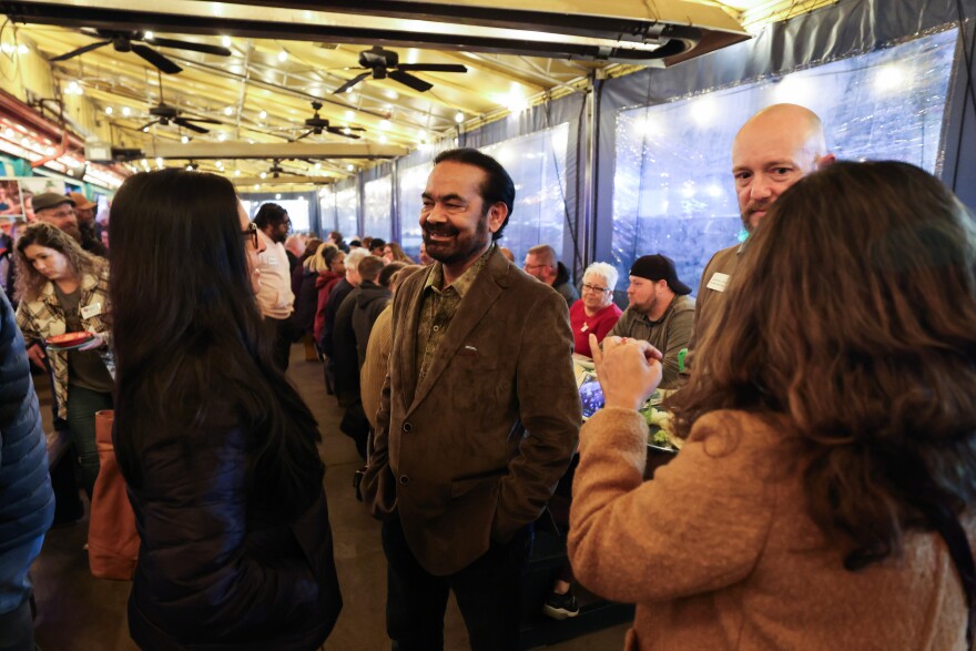 Sandeep Srivastava chats with residents during a Collin County Democratic Party happy hour Friday, Jan. 19, 2024, at Blue Goose Mexican Restaurant in McKinney.