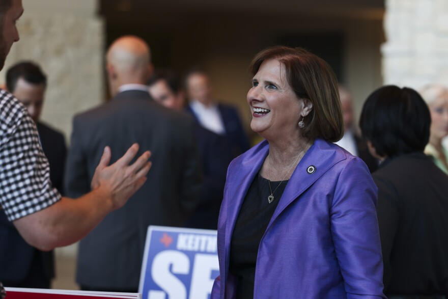 Rep. Candy Noble chats with a voter during a meet and greet before a candidate forum Tuesday, Oct. 15, 2024, at Prestonwood Baptist in Plano.