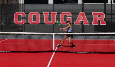 Tennis Ball in score tower with courts in background