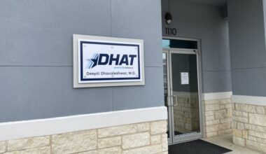 an exterior sign that says DHAT