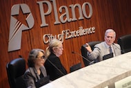 Plano Mayor John Muns (right) gestures towards the council members during a Plano City...