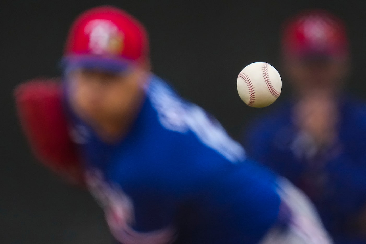 Texas Rangers pitcher Robert Garcia throws live batting practice during a spring training...