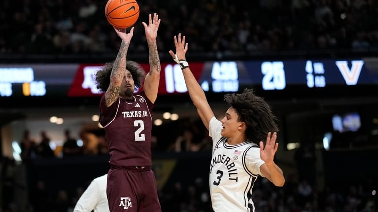 Texas A&M guard Pop Isaacs (2) shoots the ball over...