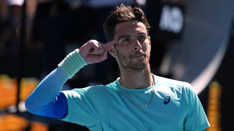 Lorenzo Musetti of Italy celebrates after defeating Taylor Fritz of...