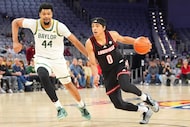 Louisville guard Mikel Brown Jr. (0) drives against Baylor center Caden Powell (44) during...