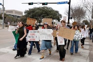 Organizer Cat Krankota (second from left) lead the group of high School students during a...