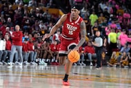 Texas Tech forward JT Toppin drives against Arizona State during the first half of an NCAA...