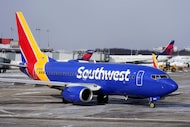 A Southwest Airlines jet is pushed back from a gate at Pittsburgh International Airport in...
