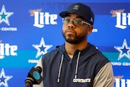 New Dallas Cowboys defensive coordinator Christian Parker listens to a question during an...