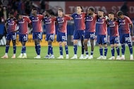 FC Dallas players lock arms as the match goes to a penalty shootout in Game 2 in the first...