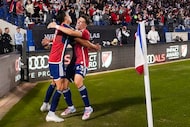 FC Dallas forward Petar Musa (9) celebrates with forward Logan Farrington (23) after scoring...