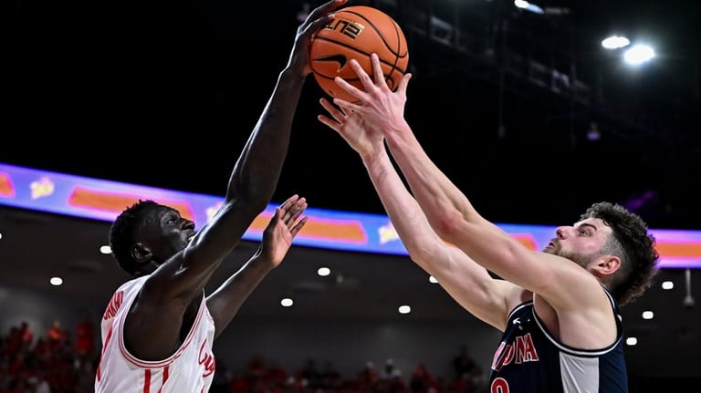 Houston forward Kalifa Sakho and Arizona guard Anthony Dell'orso (3)...