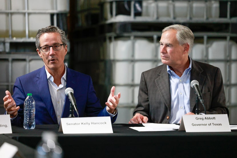 State Sen. Kelly Hancock (left) speaks alongside Gov. Greg Abbott after meeting with local...