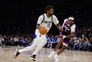 Dallas Mavericks' Naji Marshall (13) controls the ball past Minnesota Timberwolves' Jaden...