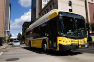 A Dallas Area Rapid Transit bus rolls through downtown Dallas in September 2024. 