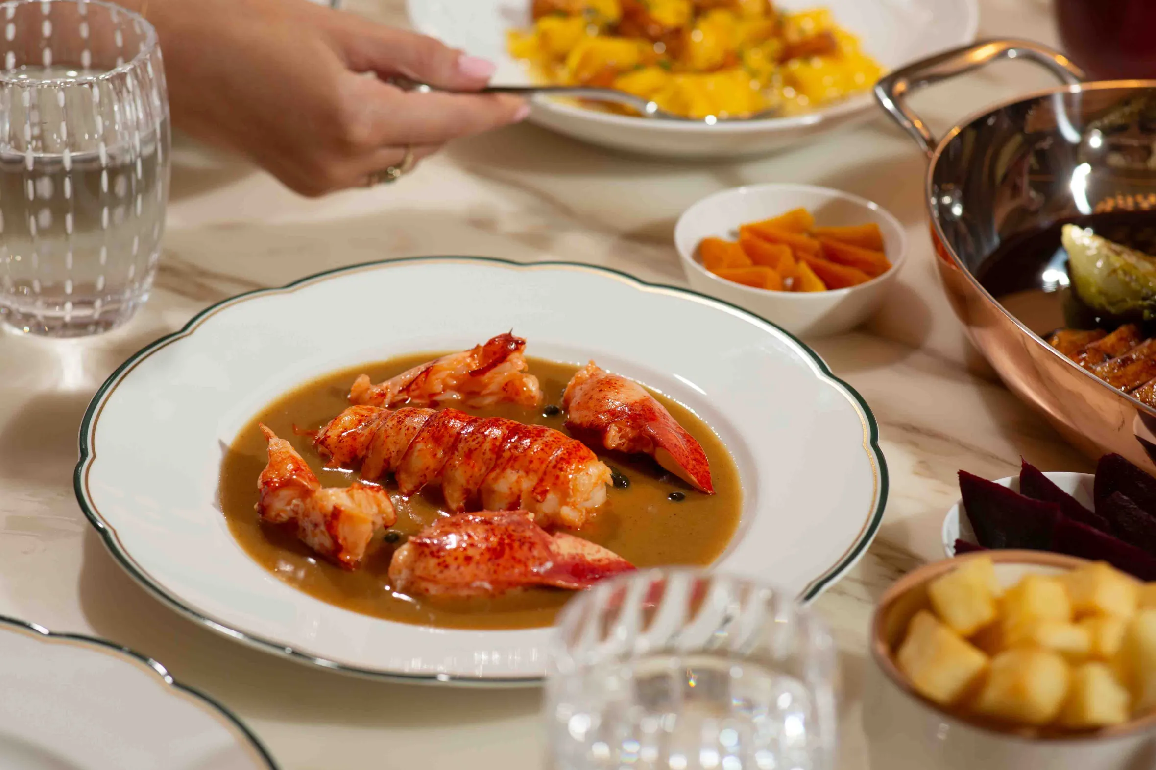 A plate of lobster tails in sauce at Mamami Restaurant.
