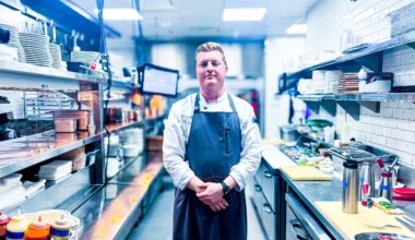 Chef Reilly Brown standing in his kitchen at Frenchie.