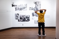 Mikael Chambers, 14, views the "Icons of Liberation" exhibit at the African American Museum...