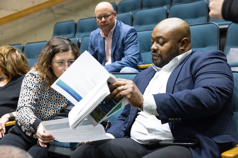 Alyssa Siffermann, interim executive director of Fair Park First, looks at a presentation...