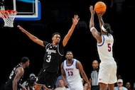SMU guard Jaron Pierre Jr. (5) hits a three point basket over Texas A&M guard Rylan Griffen...