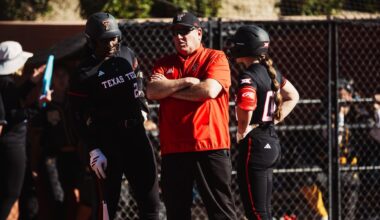 Kaitlyn Terry celebrating a hit against a team that texas tech softball is playing against