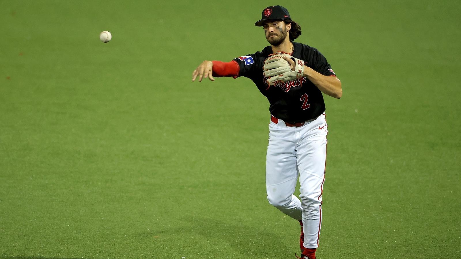 Xavier Perez high fives third-base coach Kyle Cheeseborough as he rounds the bases.