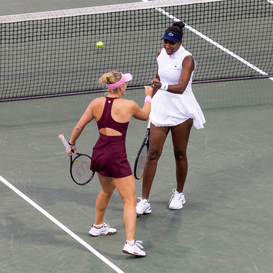 Venus Williams, right, fist bumps partner Peyton Stearns at the net during a doubles match against Storm Hunter and Taylor Townsend in the ATX Open at Westwood Country Club.