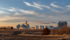 Farmland producing ethanol for the oil and gas industry. Railroad tankers cars lined up near a ethanol plant at sunset_Photo by photogrfx via AdobeStock_496174713.png